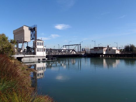 Historic Fourth Street Bridge, build in 1910, and abondoned restruat Carmens as viewed from Mission Creek, San Francisco on a clear day.