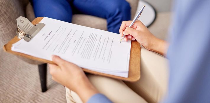 Shot of two unrecognizable people doing paperwork.