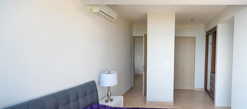 Interior of an apartment in Cancun room with wardrobes