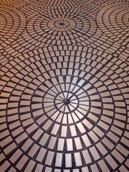 Circle tiled pattern floor with light reflecting off it.  Good for trippy background image.