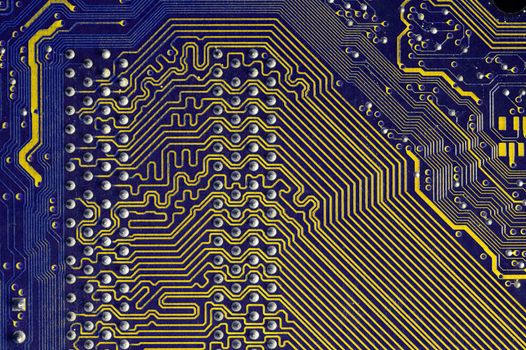 Printed neon purple yellow circuit board. Electronic computer technology. Motherboard digital chip. Background of technical sciences. Built-in communication processor. Information engineering component