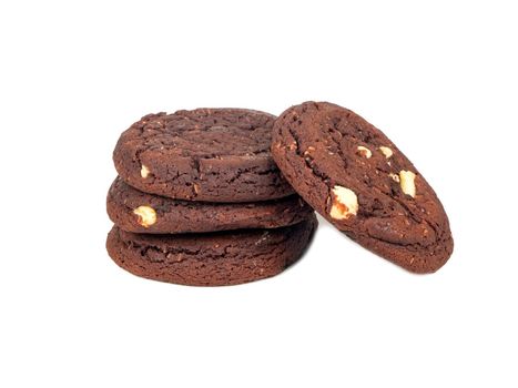 Stack of chocolate cookies with coconut slices on a white background