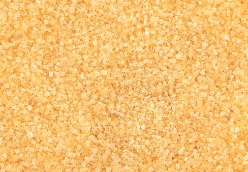 Background of scattered brown sugar close up