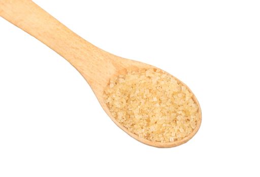 Wooden spoon with brown sugar close-up on a white background