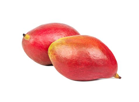 Two delicious red mango fruit isolated on a white background