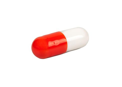 Red and white capsule isolated on a white background
