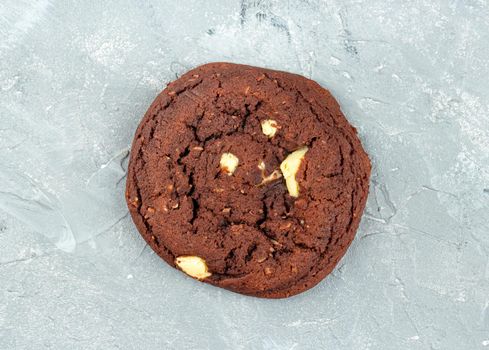 Homemade chocolate cookies on a light background, top view