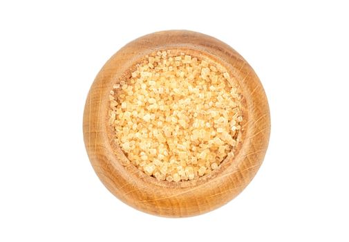 Brown sugar in a wooden container isolated on a white background, top view