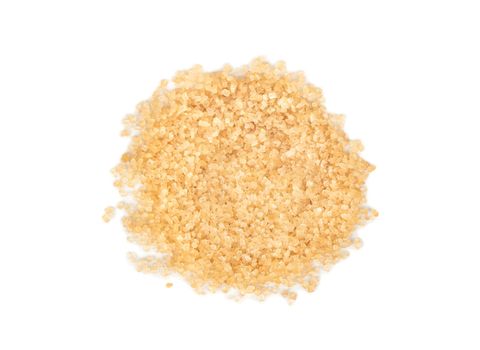 Pile of brown sugar on a white background, top view