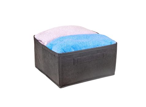 Black box with towels isolated on a white background
