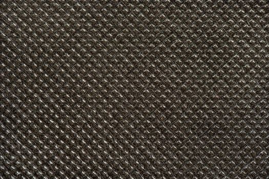 Textured dark fabric background close up