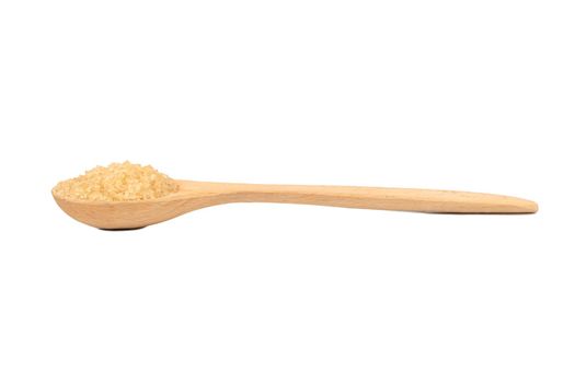 Wooden spoon with brown sugar on a white background