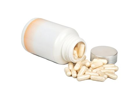 Capsules with a plastic jar on a white background