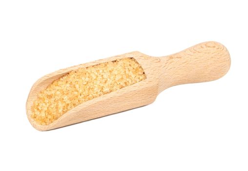 Wooden scoop with brown sugar isolated on white background