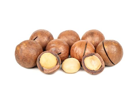 Macadamia nuts in a shell and without on a white background