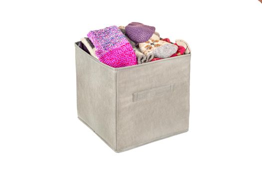 Pile of socks in a beige underwear box isolated on a white background