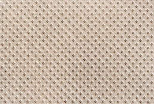 Beige textured fabric background close up