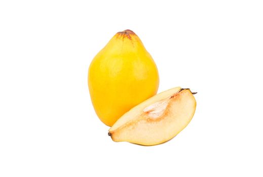 Big ripe fruit quince with a slice on a white background