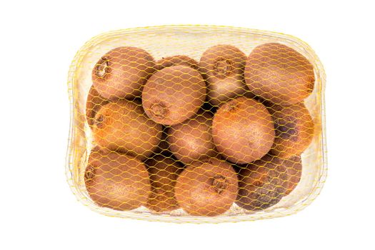 Fruit kiwi in transparent plastic bag with a netting on a white background top view