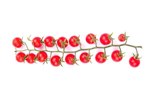 Sprig of small fresh red cherry tomatoes on a white background