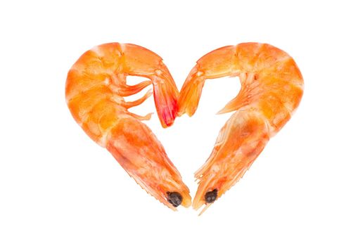 Two boiled shrimp in the shape of a heart on a white background