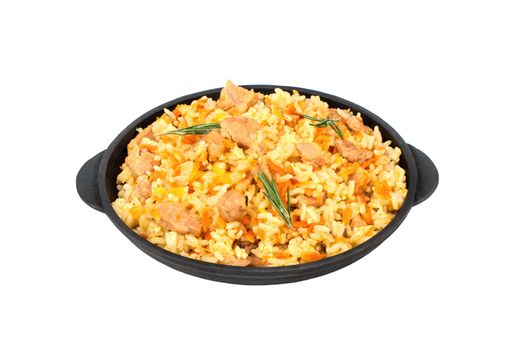 Traditional Uzbek pilaf in portioned frying pan on a white background