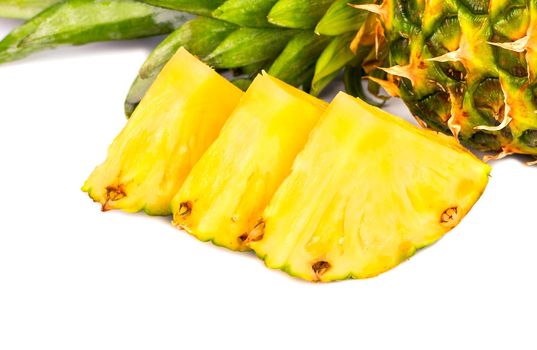 Three slices of fresh pineapple fruit closeup