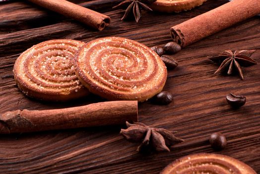 Cookies on a table with spices and coffee beans