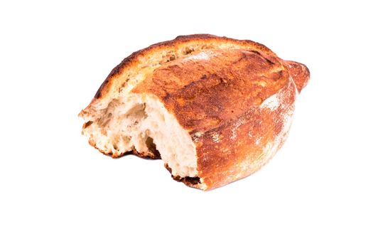 Half of fresh homemade French bread on a white background