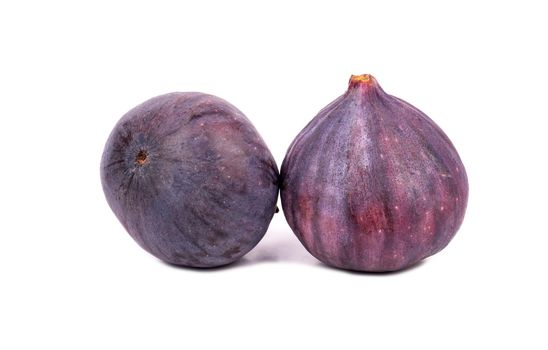 Two fresh and ripe figs isolated on white background