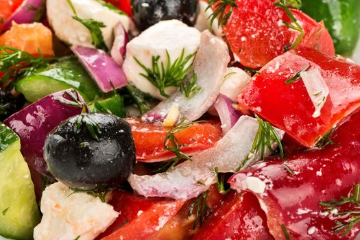 Fresh Greek salad on the plate closeup