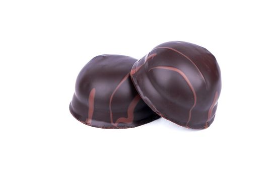 Two big chocolate candy with filling on white background