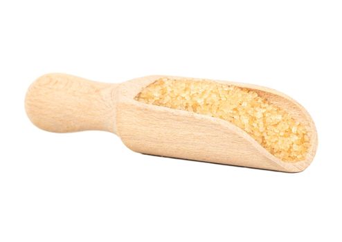 Wooden scoop with brown sugar isolated on white background