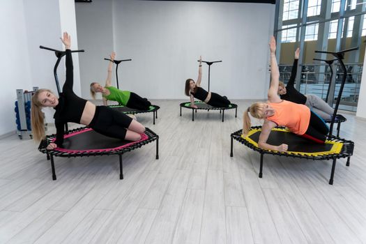 Lie down trampoline active center group fitness friends youth wellness activity, for training girl from fit from healthy happy, class sporty. Jump gymnast studio, room