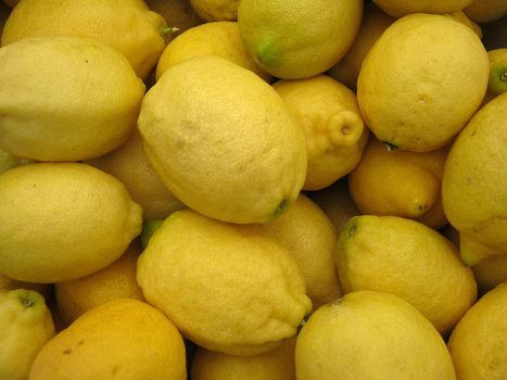 Pile of Organic large Lemons found at a farmers market                               