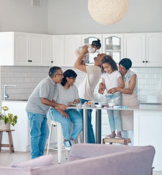 Shot of a family baking together.