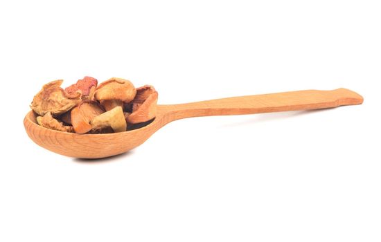 Wooden spoon with dry fruit slices of apple on white background
