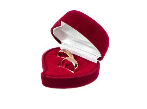 Two wedding rings in red box on white background