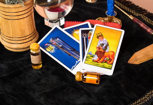 Laid out Tarot cards with magical decorations on the table