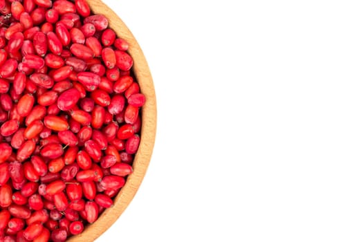 Part of bowl of fresh barberry on white background, top view