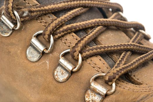Laces on the old brown leather boots closeup