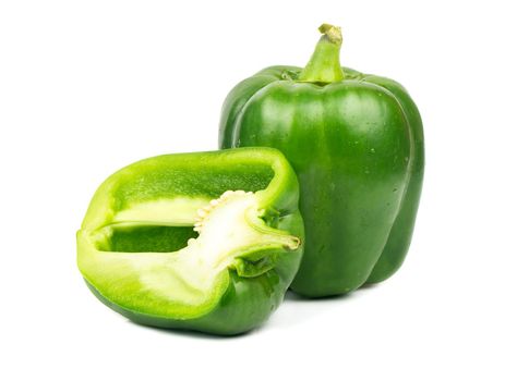 Fresh green pepper with half on white background
