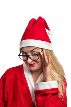 Young girl in a Santa suit and sunglasses on white background