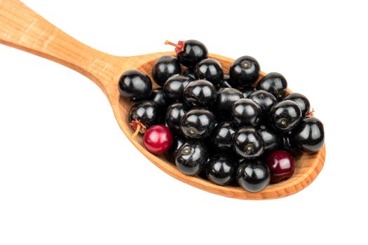 Fresh bird cherry in spoon on white background closeup