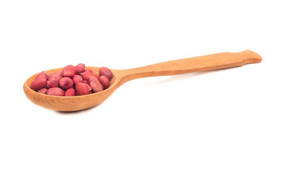 Kernel peanut in wooden spoon isolated on white background