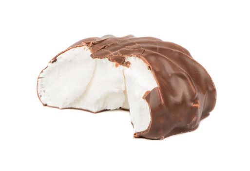 Bitten off a delicious marshmallow in chocolate on a white background