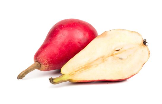 Ripe red pear with a juicy half on white background