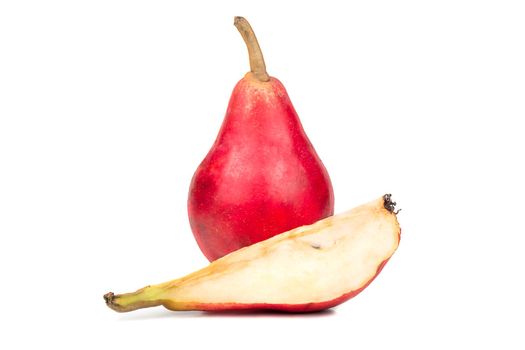 Fresh red pear with a slice isolated on white background