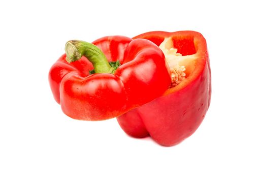 Cut in half fresh red pepper on white background