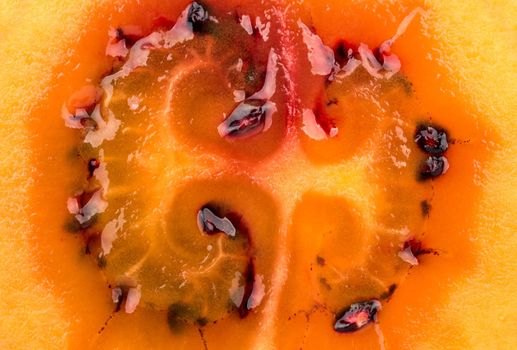 Background of juicy half fruit tamarillo closeup